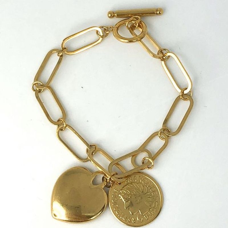 Armbånd med gullhjerte og coin